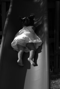 Girl_playing_on_slide_image